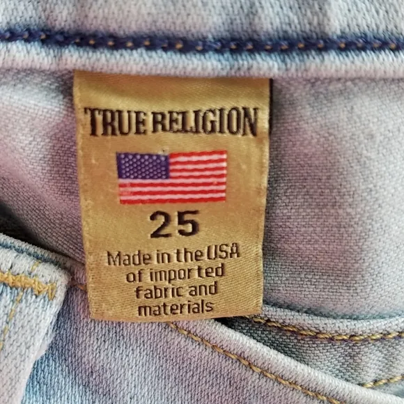 TRUE RELIGION Cora Mid Rise light wash cut off jean shorts raw hem Size 25